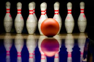 Bowling ball approaching pins